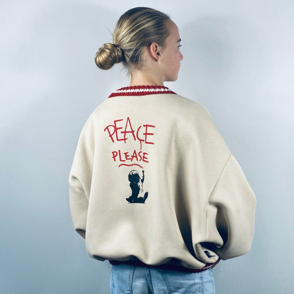 SOOI SWEATER TEACH PEACE